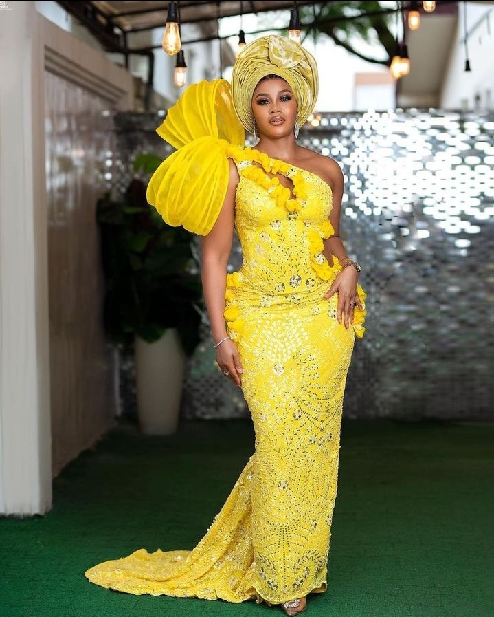Best and Stunning 2023 Asoebi Gown Styles for Yellow Lace. - Ladeey